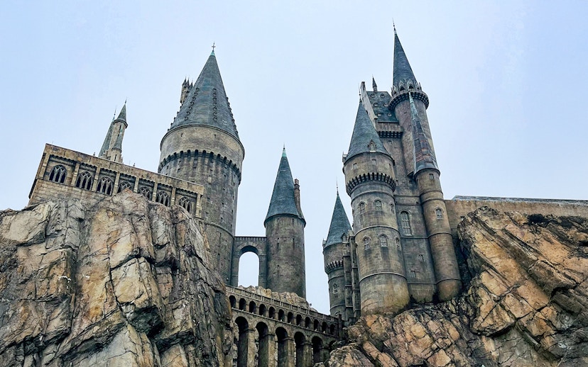 Hogwarts castle at Universal Studios Orlando, featuring stone towers and rocky landscape.