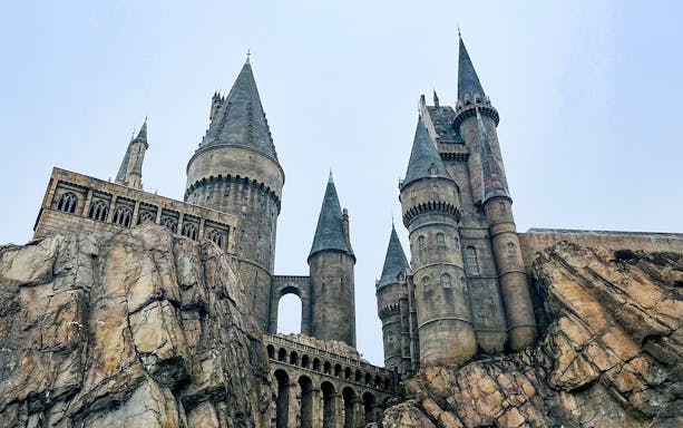 Hogwarts castle at Universal Studios Orlando, featuring stone towers and rocky landscape.