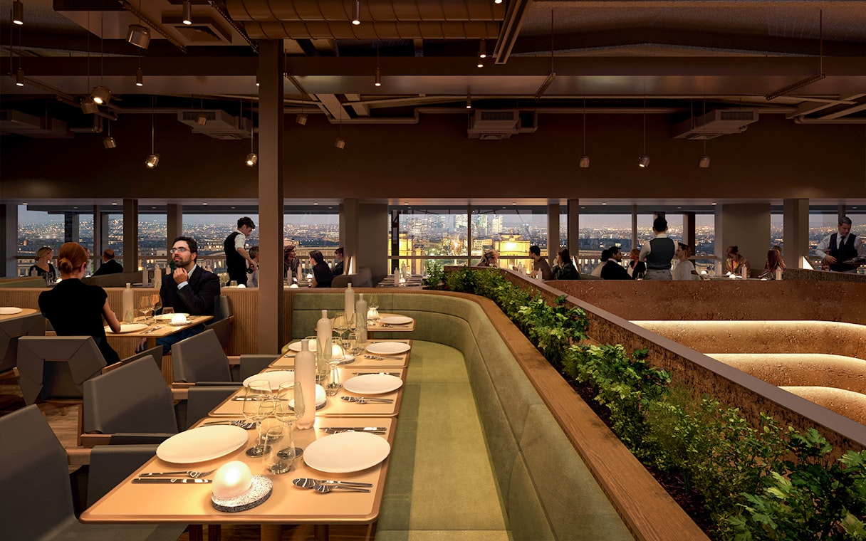 Dining area inside Eiffel Tower's Madame Brasserie with city view.