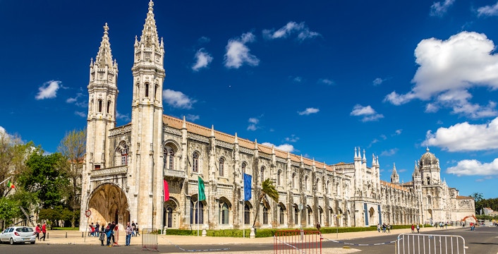 Jeronimos Monastery in Lisbon, Portugal, with ornate Gothic architecture and two prominent towers.