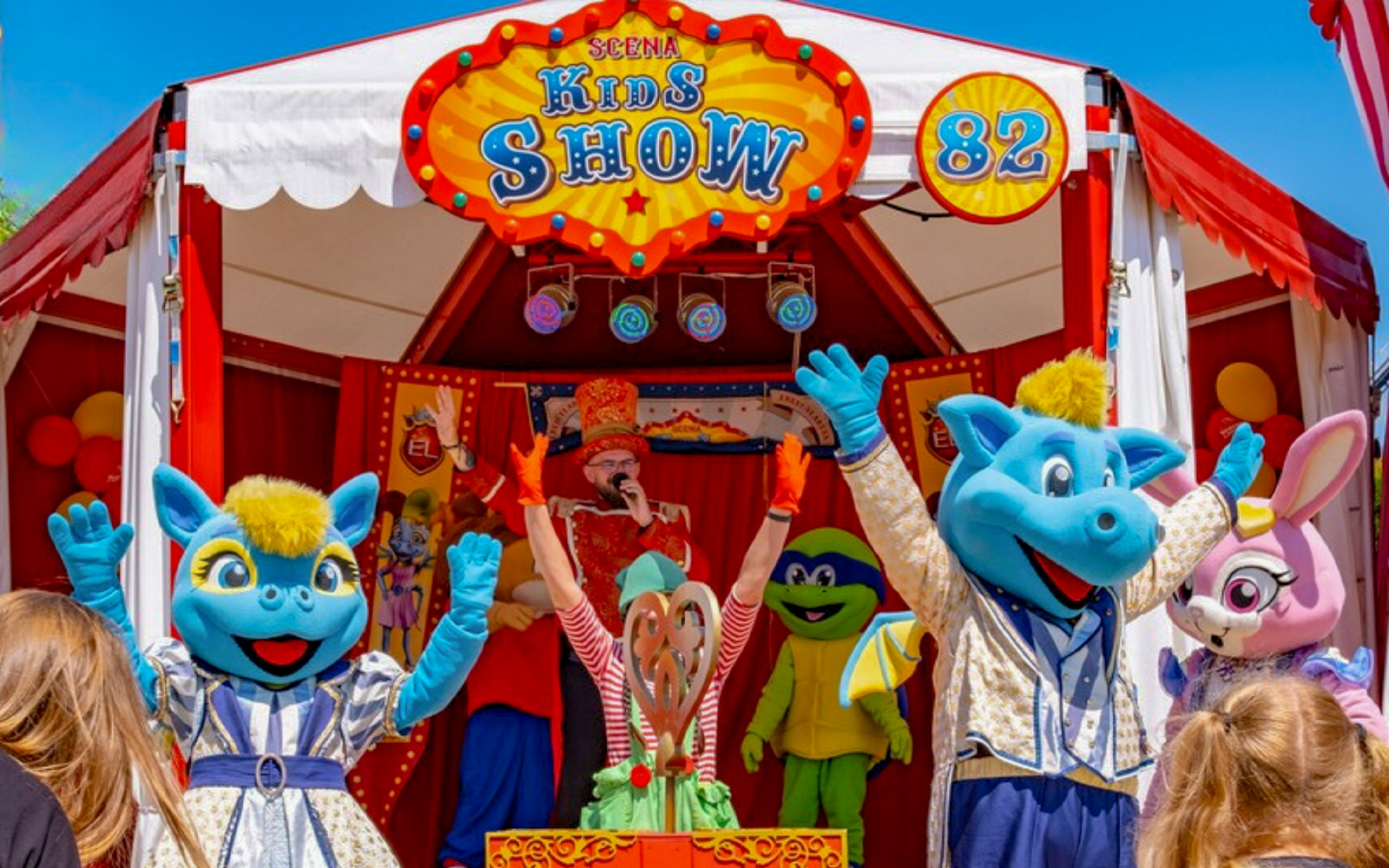 Children enjoying a colorful performance at Scena Kids Show in Energylandia, Poland.