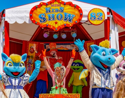 Children enjoying a colorful performance at Scena Kids Show in Energylandia, Poland.