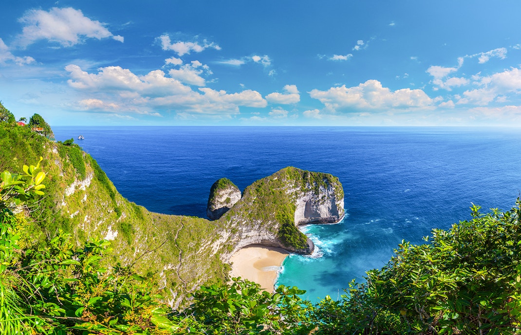 Scenic view of Kelingking Beach on West Nusa Penida Island with cliffs and ocean.