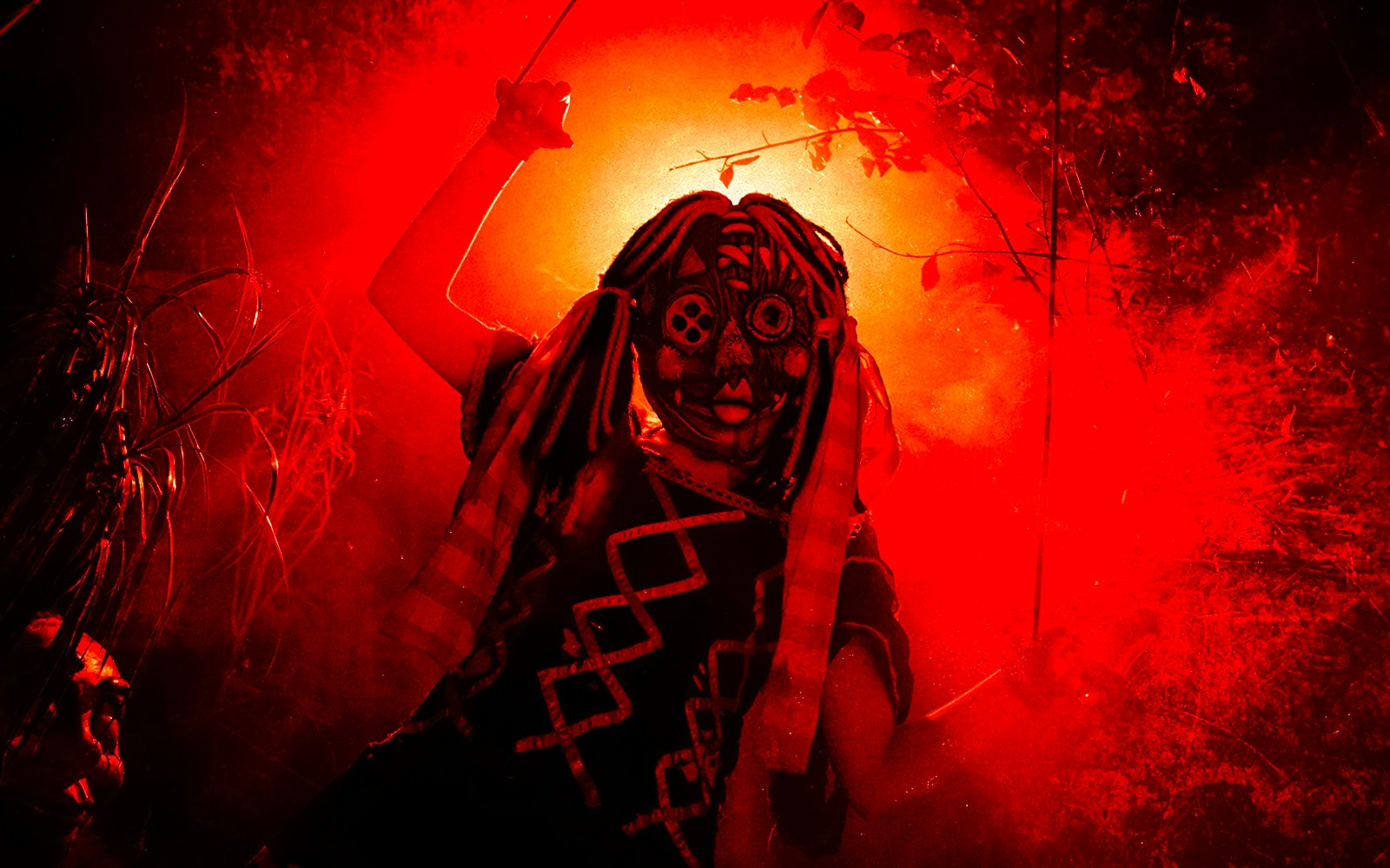 Person in a tribal mask and costume at Halloween event in Thorpe Park.