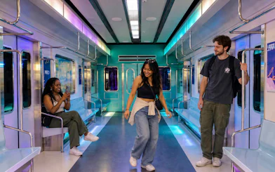 Guests enjoying K-POP Fan Tour in Seoul subway-themed setting.