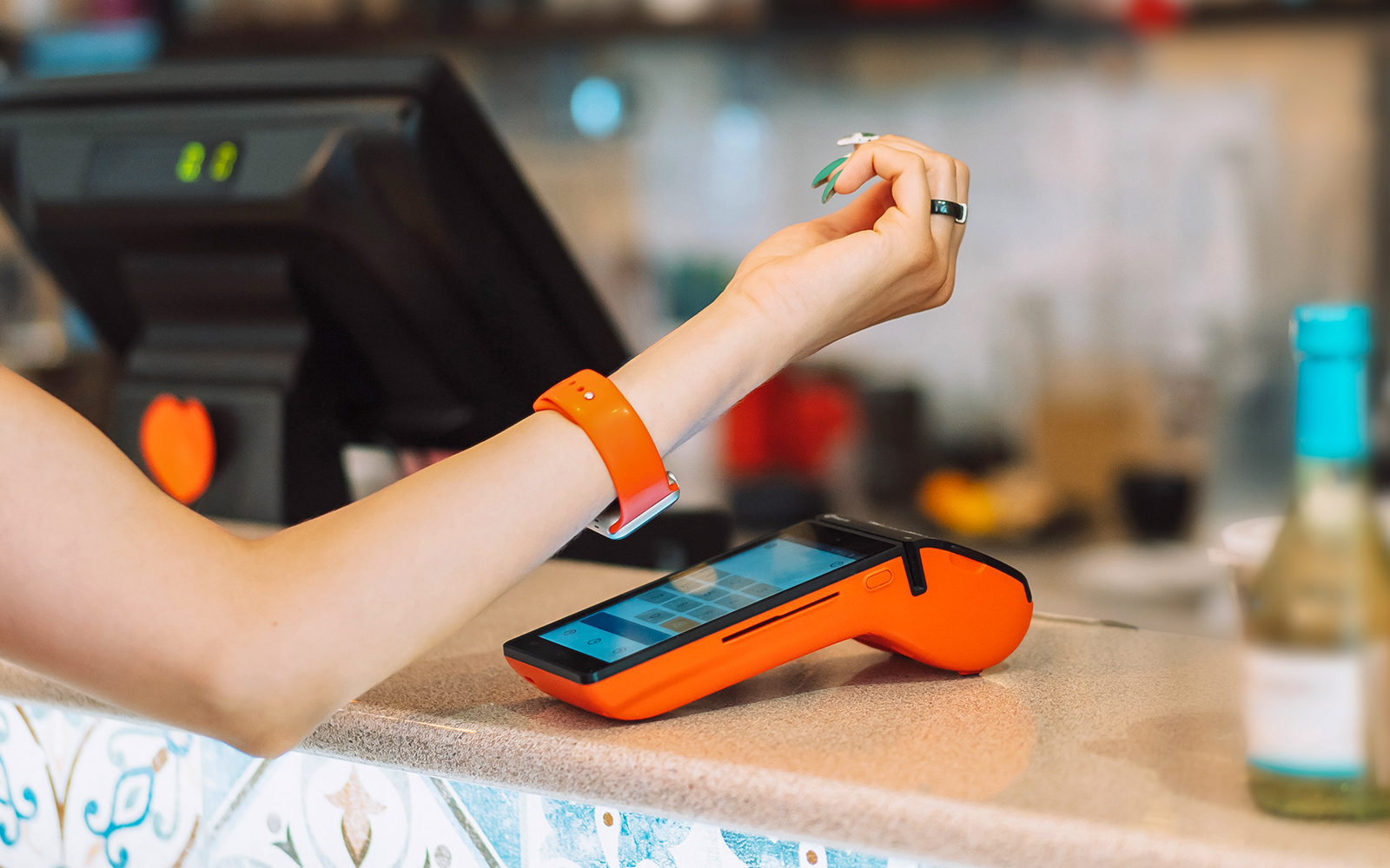A woman doing a Contactless payment