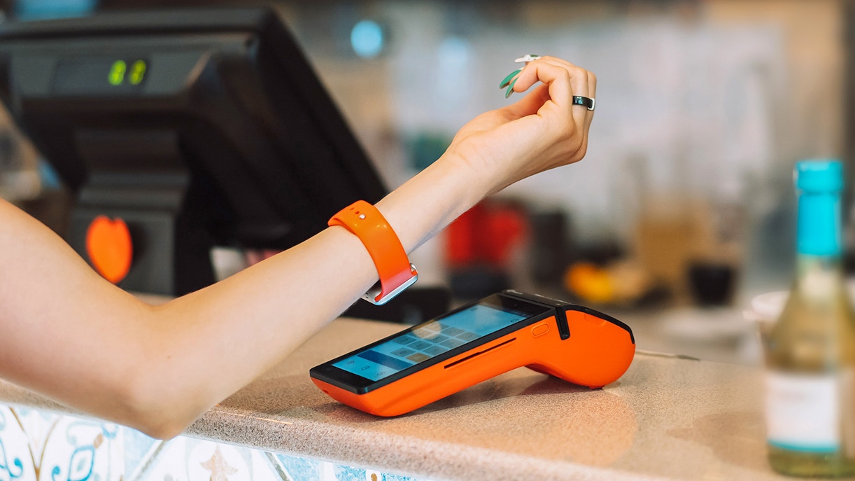 A woman doing a Contactless payment