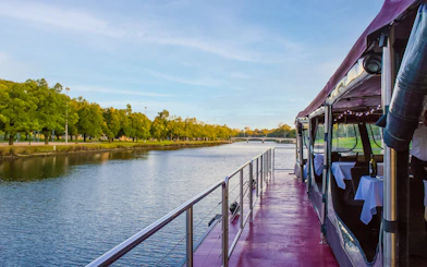 Cruise boat on Yarra River in Melbourne with tables set for brunch.