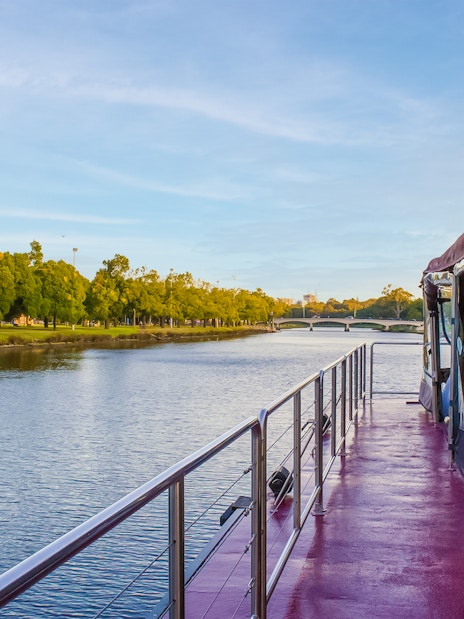 Cruise boat on Yarra River in Melbourne with tables set for brunch.