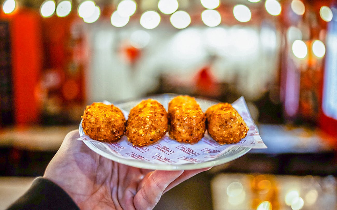 Plate of croquettes served on a food tour in La Barceloneta, Barcelona.