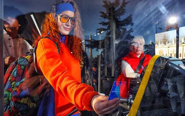 Tourist using Istanbul City Card on hop-on hop-off bus tour.
