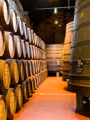 Barrels aging wine in Calem Caves, Porto, Portugal.