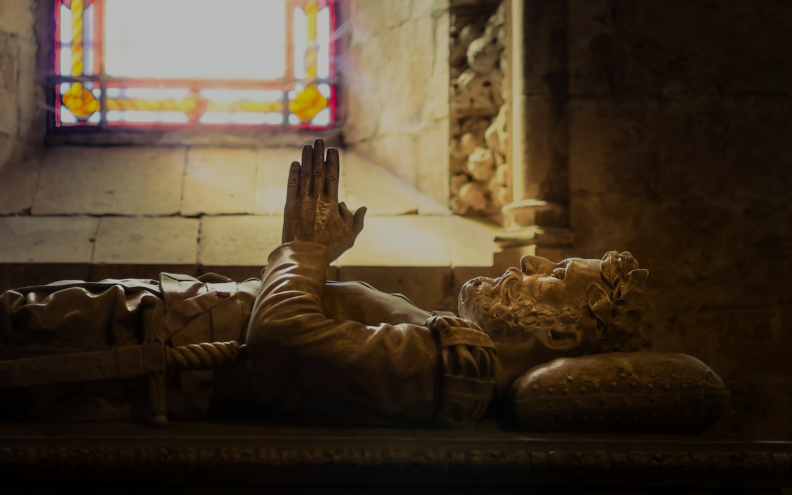 Tomb of Luis de Camões with stained glass window in Jerónimos Monastery, Lisbon.