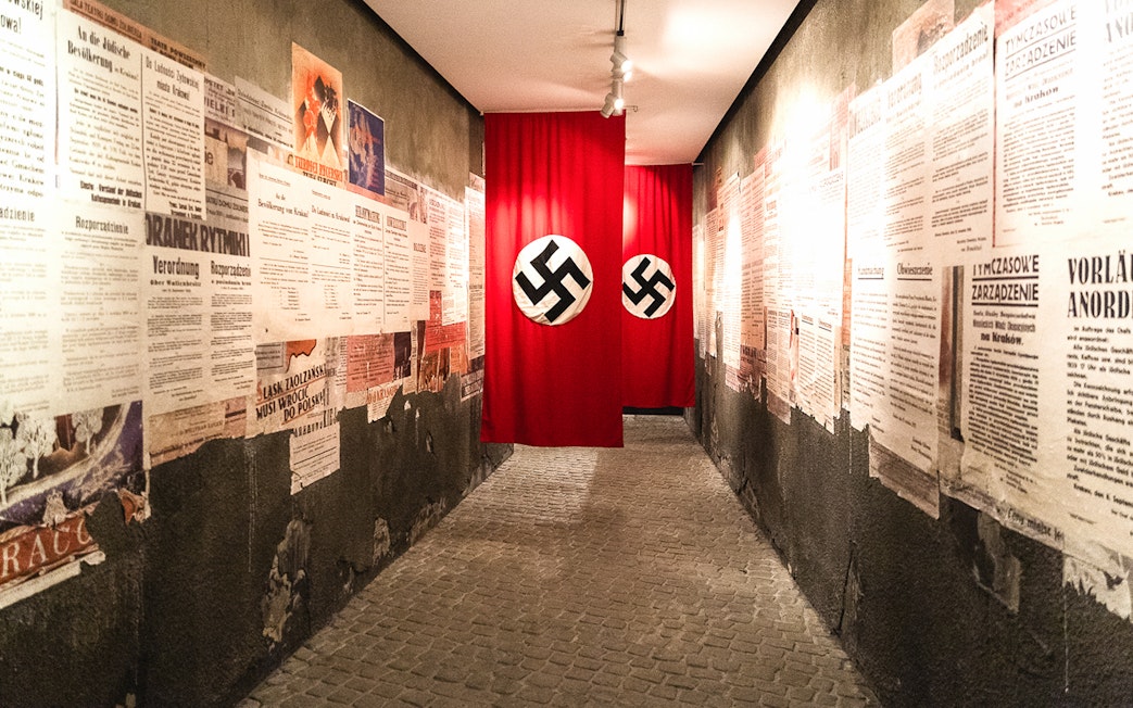 Hallway with historical posters and Nazi flags inside Oskar Schindler's Factory, Krakow.