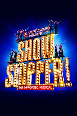 Performers on stage during Showstopper! The Improvised Musical in London theater.