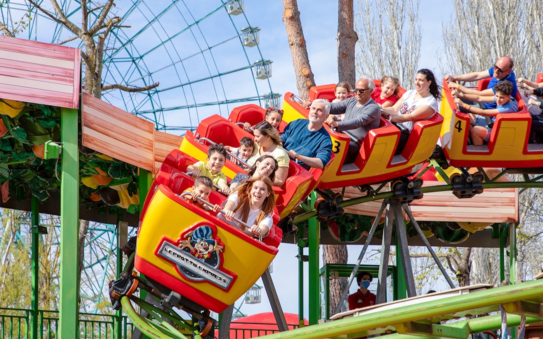 Visitors enjoying a roller coaster ride at Mirabilandia Park.