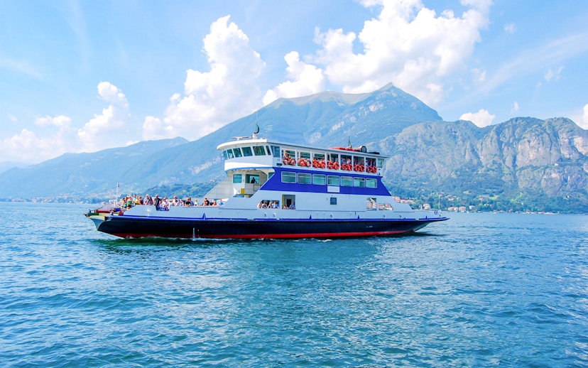 Cruise boat on Lake Como with views of Bellagio and surrounding mountains.