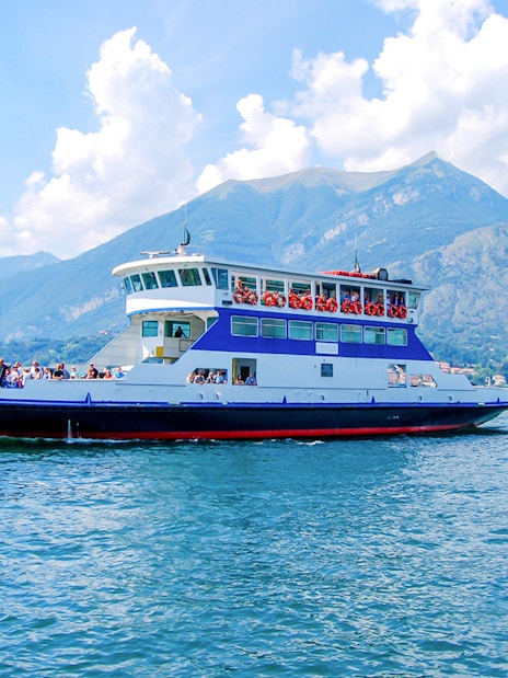 Cruise boat on Lake Como with views of Bellagio and surrounding mountains.