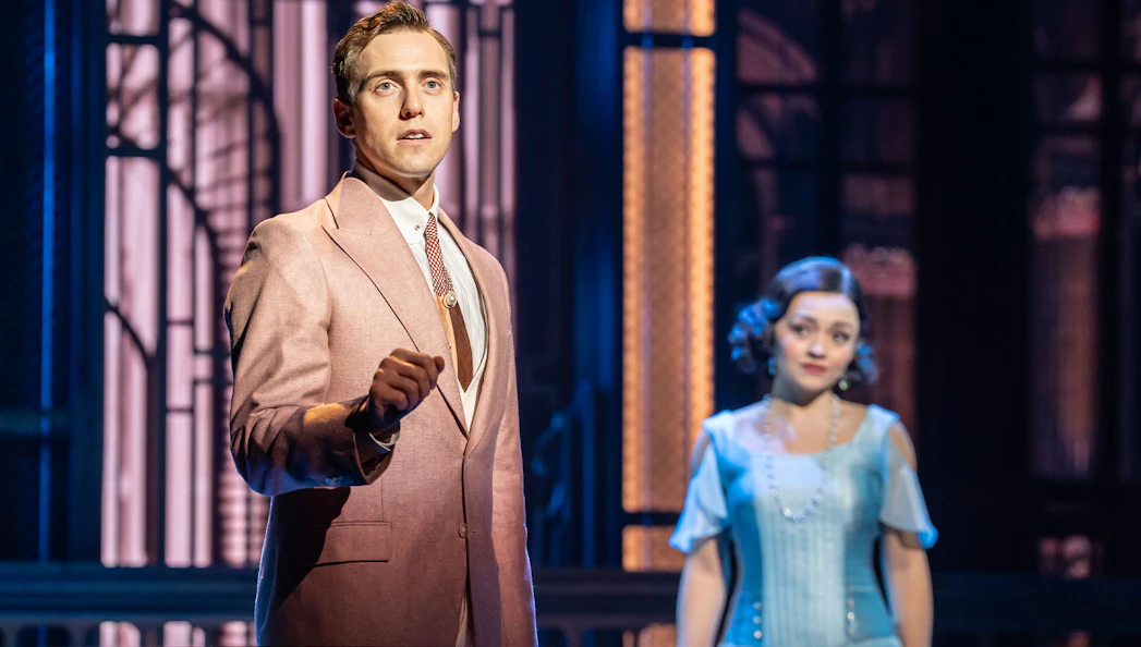 Actors performing a scene in The Great Gatsby Musical on stage.