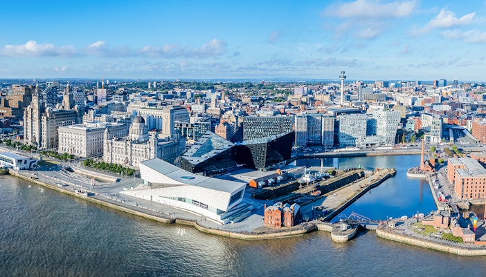 The drone aerial view of Liverpool with Mersey river in foreground.