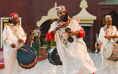 Musicians performing traditional Moroccan music at Chez Ali Dinner & Fantasia Show.