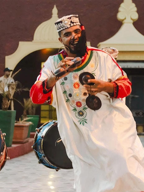 Musicians performing traditional Moroccan music at Chez Ali Dinner & Fantasia Show.