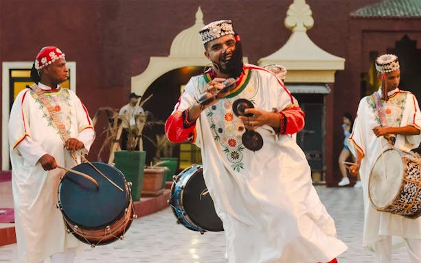 Musicians performing traditional Moroccan music at Chez Ali Dinner & Fantasia Show.
