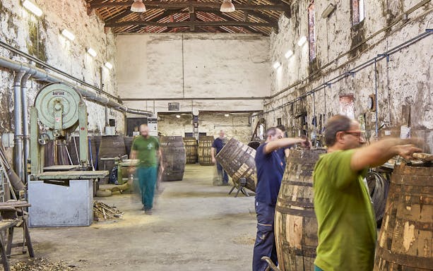 Workers crafting barrels in a traditional winery for Cockburn's French tour and Super Premium tasting.