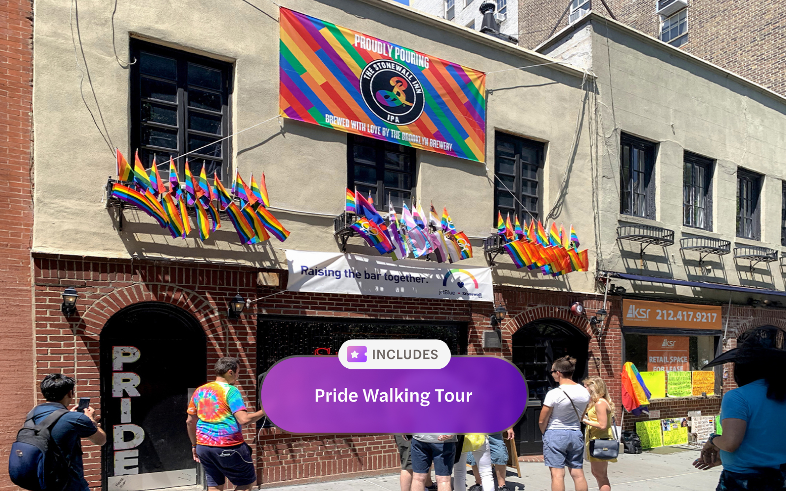 Stonewall Inn with rainbow flags during Pride Walking Tour in New York City.
