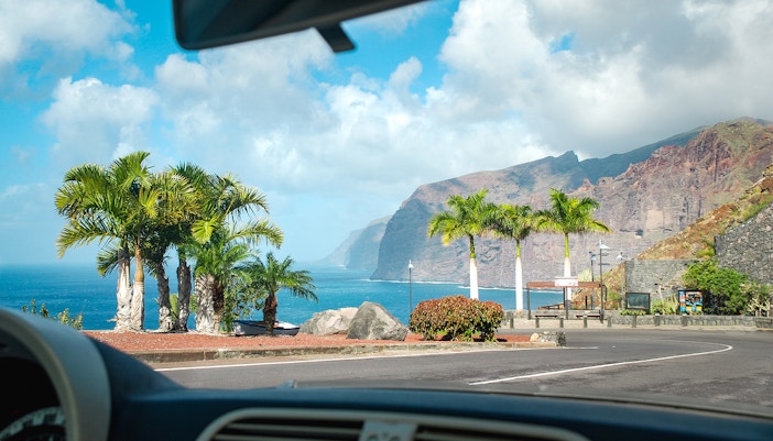 View of Los Gigantes cliffs and ocean from a car in Tenerife, Spain.