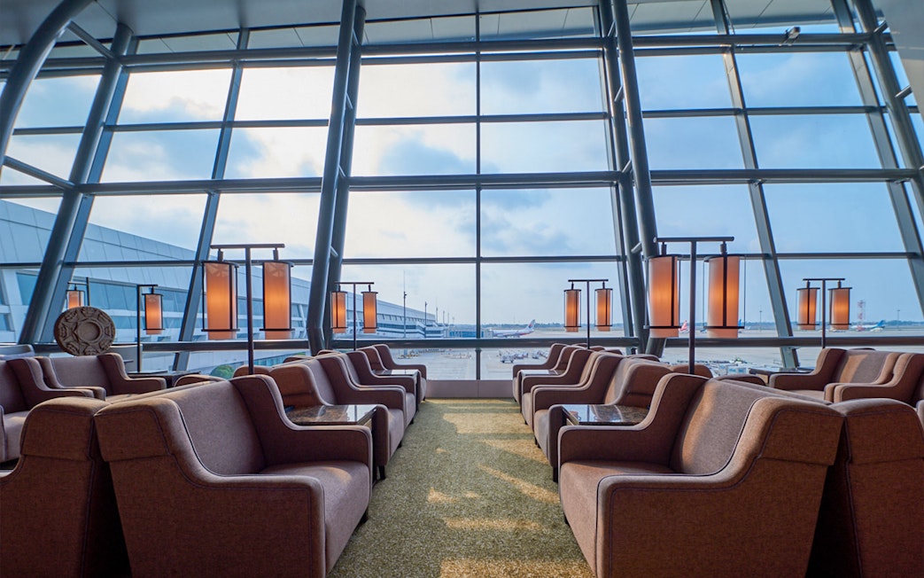 Sapphire Lounge seating area, T3 International Departures, near Gate 7, with airport view.