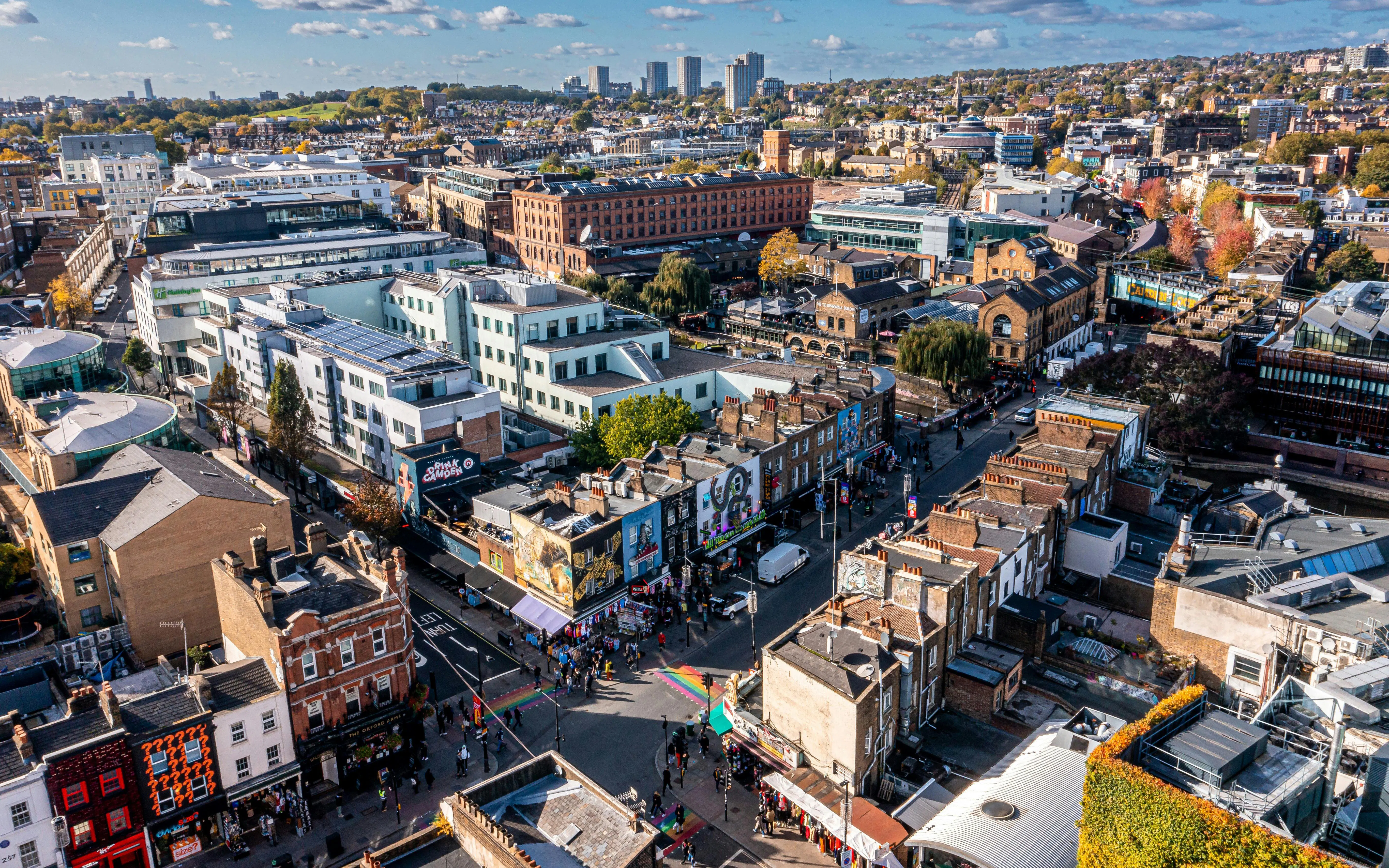 Aerial view of Camden Lock Market with colorful buildings and bustling streets in London, UK.