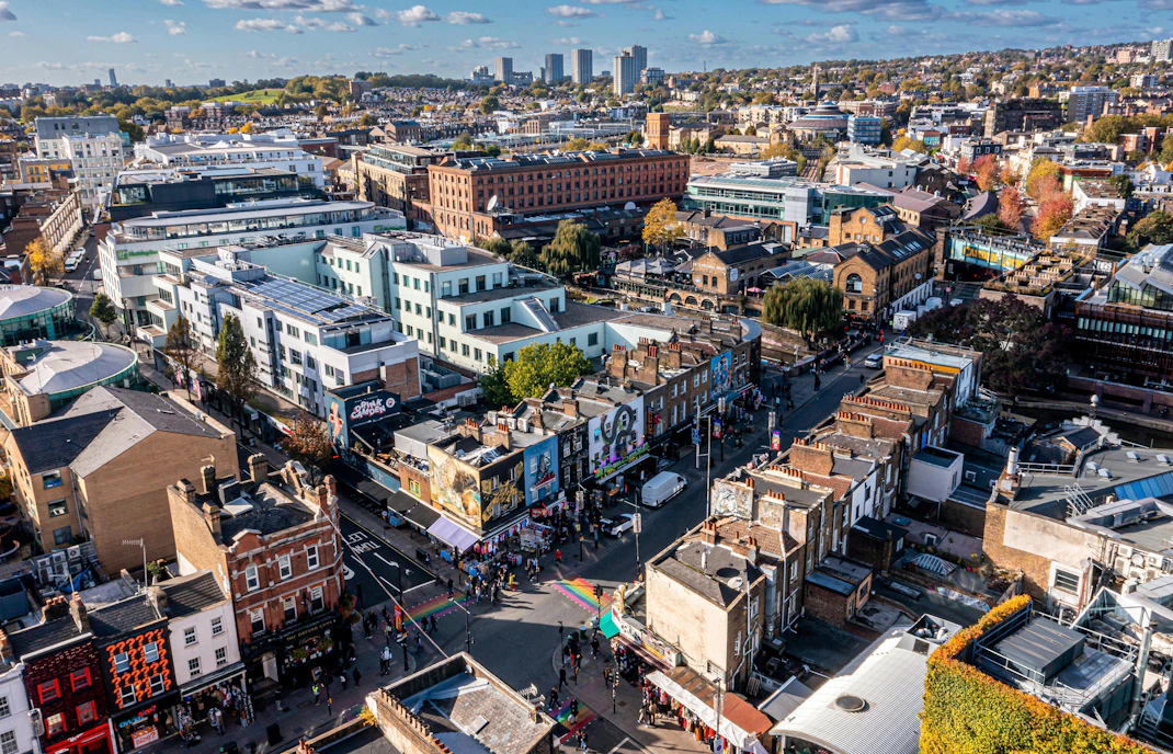 Aerial view of Camden Lock Market with colorful buildings and bustling streets in London, UK.
