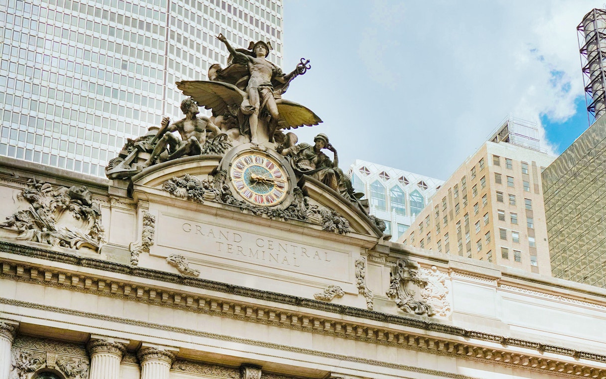 Grand Central Terminal facade with clock and sculptures in New York City.