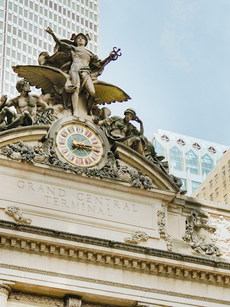 Grand Central Terminal facade with clock and sculptures in New York City.