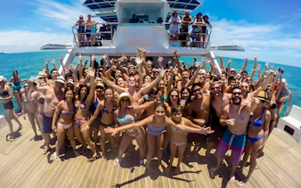 Tourists enjoying a catamaran cruise on Buzios Full Day Tour, Brazil.