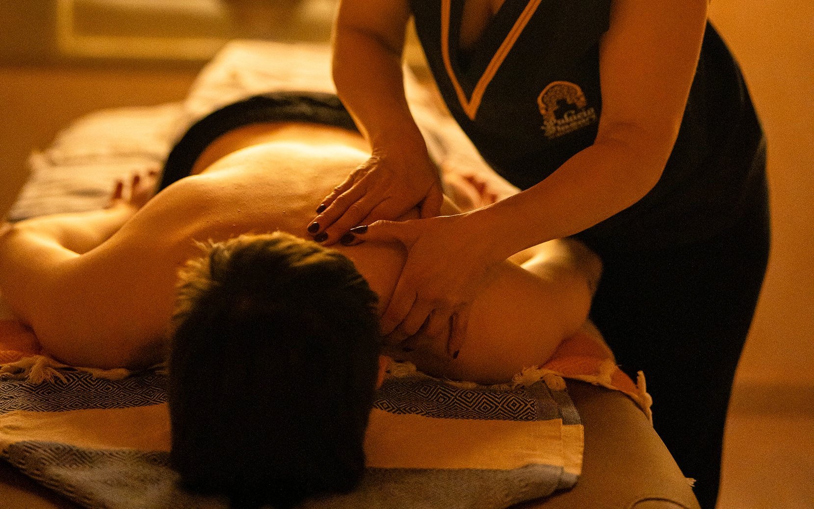 Visitors receiving a Traditional Hammam massage in Granada.