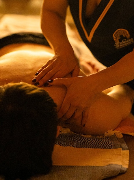 Visitors receiving a Traditional Hammam massage in Granada.