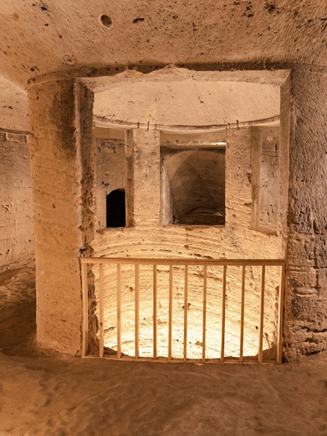 Inside view of ancient stone columns in the Catacombs of Kom el Shoqafa, Alexandria, Egypt.