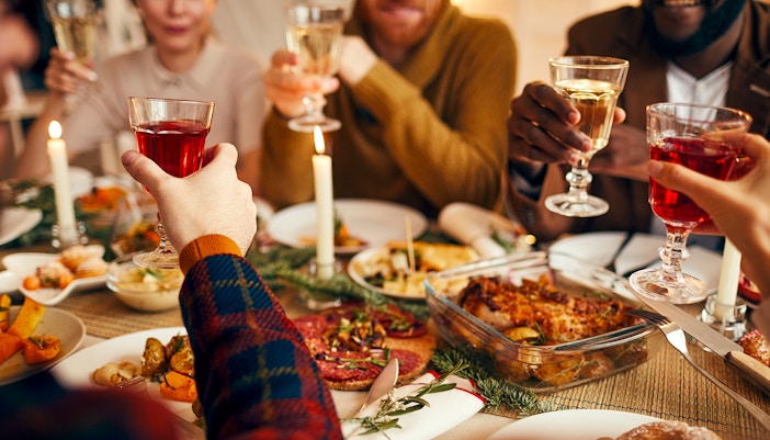 Tourists enjoying a three-course dinner during a small group day and night tour of Niagara.