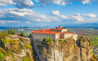 St Stephen’s Monastery perched on a cliff in Meteora, Greece, with panoramic views of the valley below.