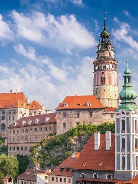 Cesky Krumlov castle and town view with red rooftops and tower, Czech Republic.