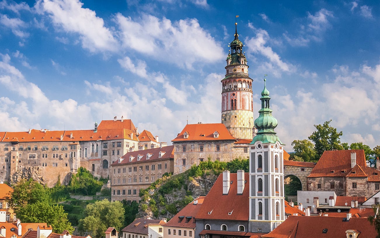Cesky Krumlov castle and town view with red rooftops and tower, Czech Republic.
