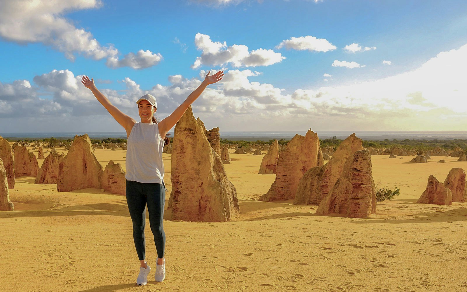 Pinnacles Desert with person enjoying limestone formations