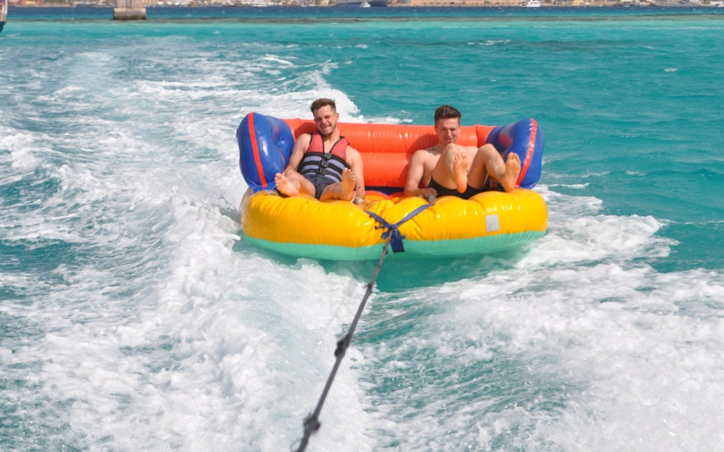 Sofa ride on turquoise waters at Orange Bay, Hurghada.