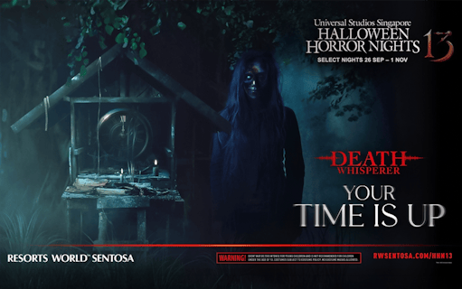 Creepy figure in dark forest at Universal Studios Singapore Halloween Horror Nights, Death Whisperer theme.