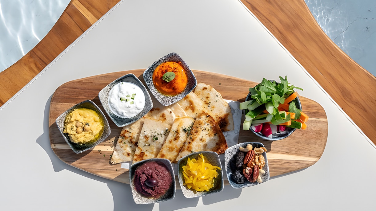 Visitors enjoying the stunning sunset view at Yona Beach Club Experience in Phuket: Sunset Terrace