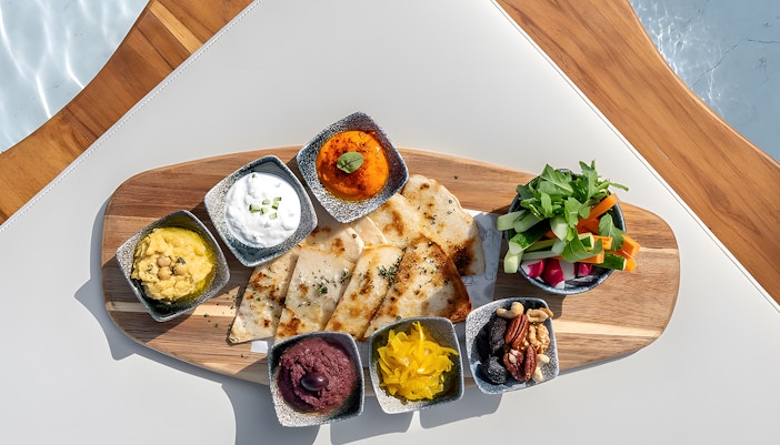 Visitors enjoying the stunning sunset view at Yona Beach Club Experience in Phuket: Sunset Terrace