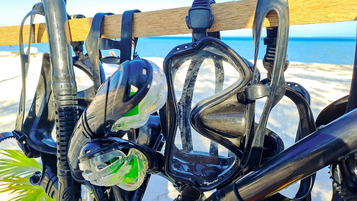 Snorkel gear hanging in a shop near the beach.