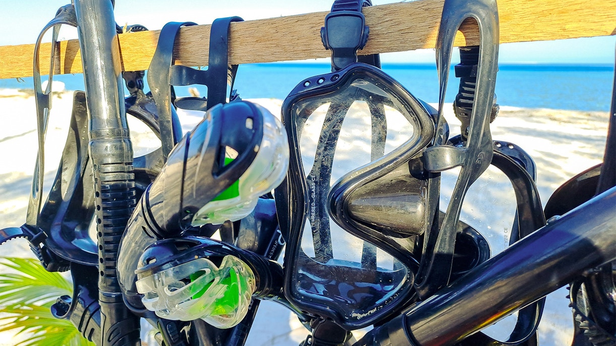 Snorkel gear hanging in a shop near the beach.